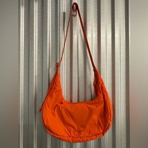 HOUSE OF HARLOW 1960 Crescent Nylon Puffy Orange Bag